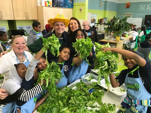 students holding lettuce 