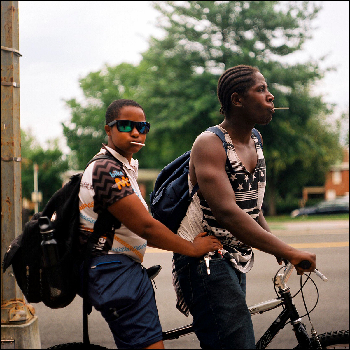 A travel storytelling slideshow featuring Murugi's photography: 1 of 9 - Two young boys ride a tandem bike in D.C.