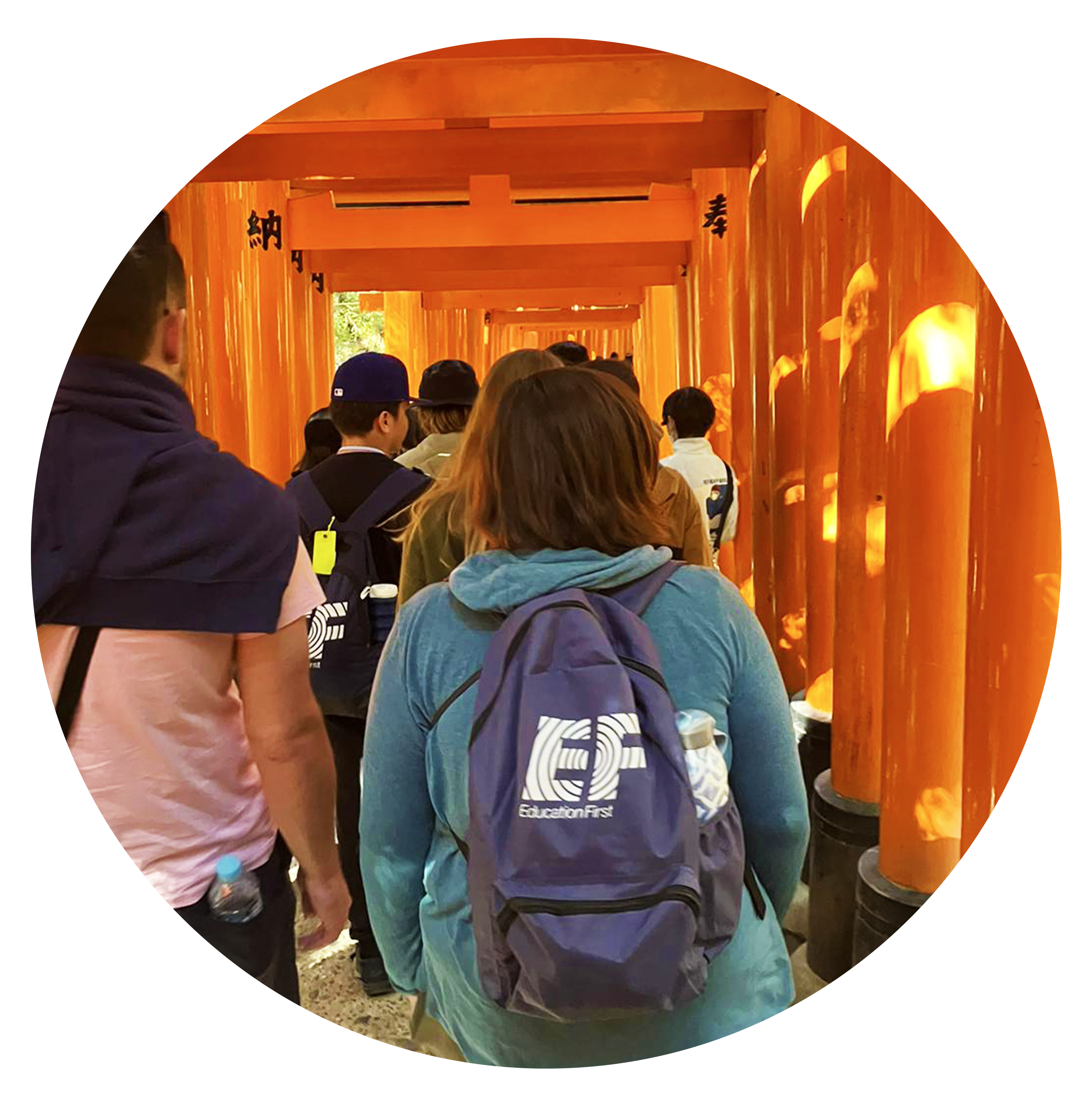 A close-up shot of EF's backpack, a sustainable travel bag, on a student at the Fushimi Inari Shrine in Japan